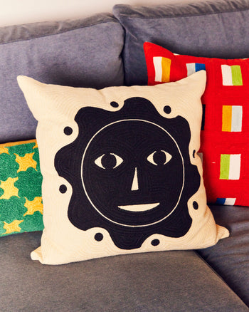 ["Dusen Dusen Everybody Sun Pillow", " If you stare directly at the sun for long enough, you will see this gorgeous face up there! (and maybe nothing else ever again)\n<br>\nFINAL SALE"]
