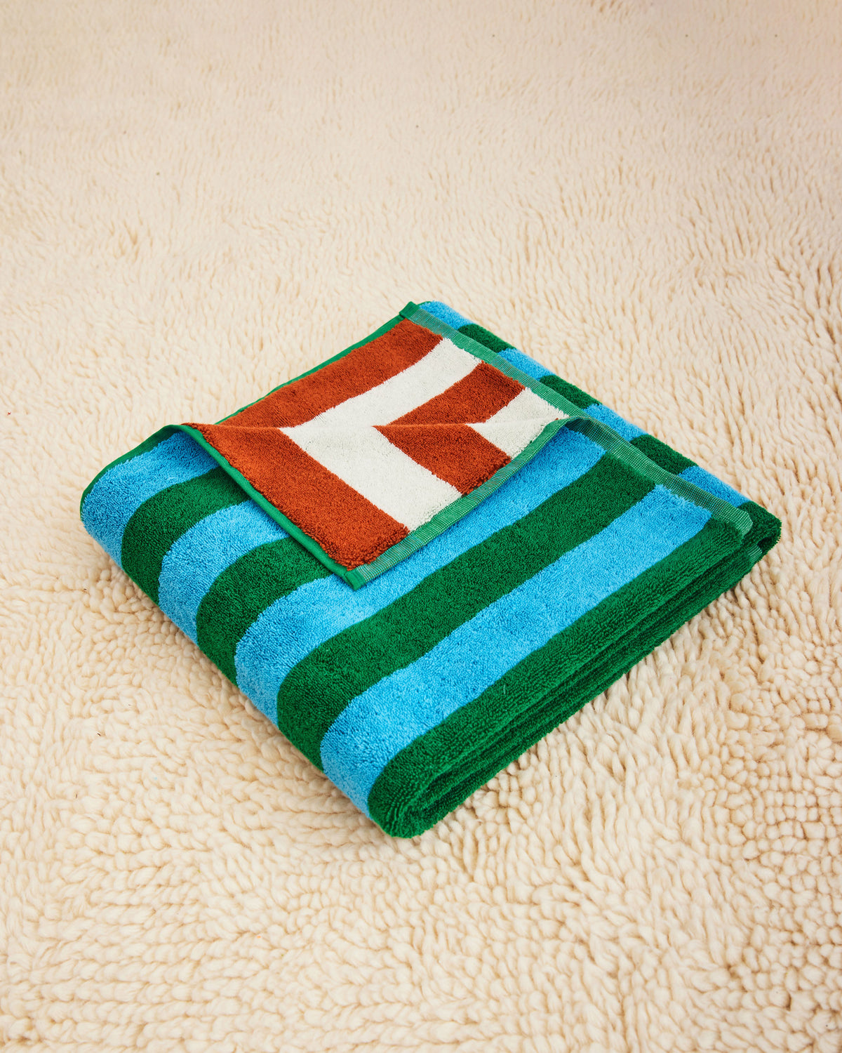 Dusen Dusen Earth Stripe Towels. 100% brushed cotton terry, 700 GSM, reversible striped colorways. Bath towel: 30"x56". Hand towel: 20"x 30". Washcloth: 12"x12". Made in Turkey.