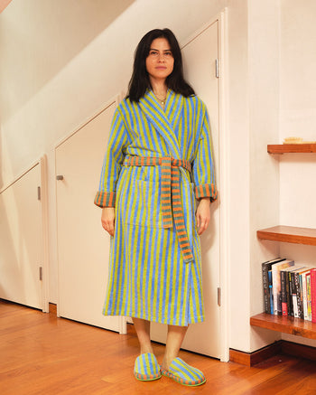 ["A woman wearing a green and yellow striped bathrobe with brown fur-trimmed cuffs and waist, standing in a home interior with wooden floors and white walls. ", " Boi-oi-oi-ng! <br> <br> Ana is 5'5\" and wears a size S, Jessica is 5'6\" and wears a size S, Jesse is 6'1\" and wears a size L"]