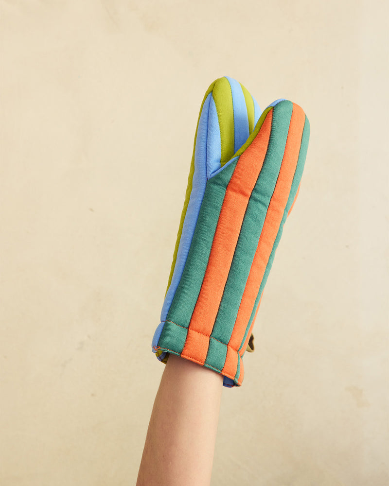 Colorful oven mitt on a beige background