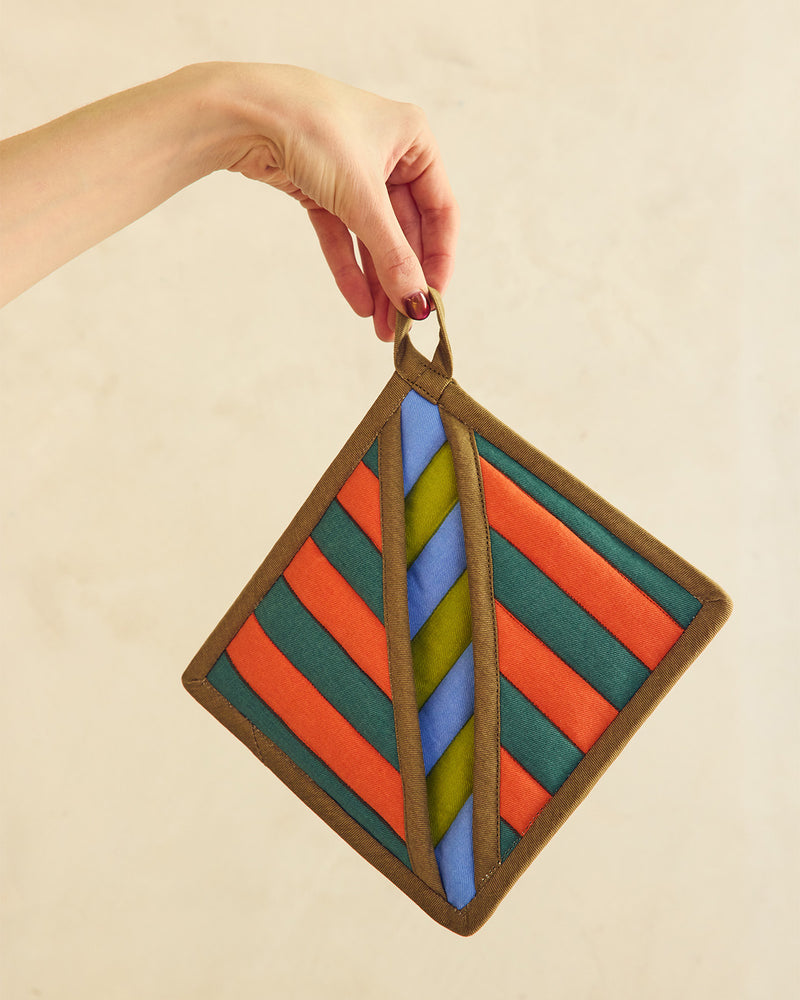 striped pot holder on a wooden surface