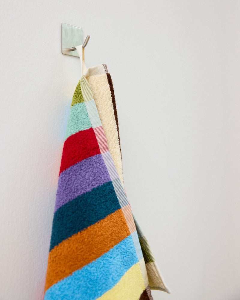 Close up of hand towel hanging loop hummingbird stripe