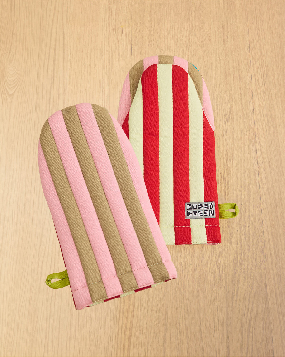 red and light green striped oven mitt with hand 