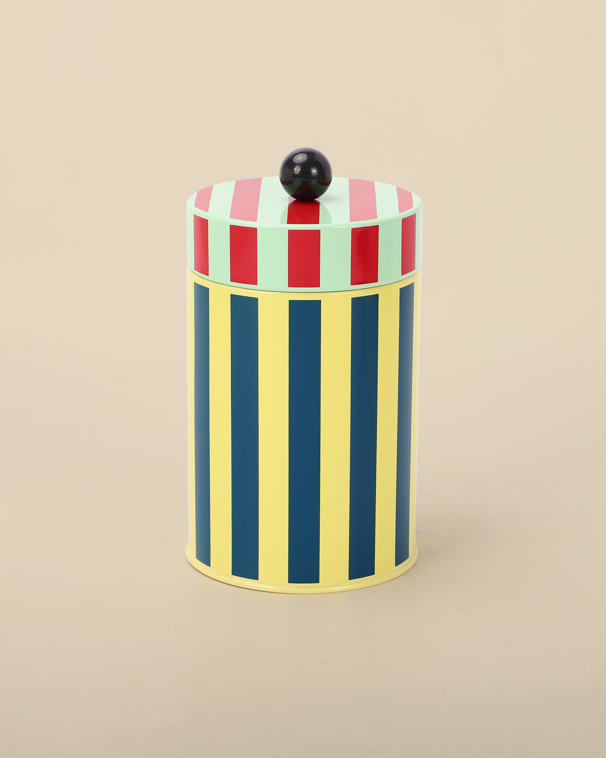 Canister with yellow, blue, red, and green stripes
