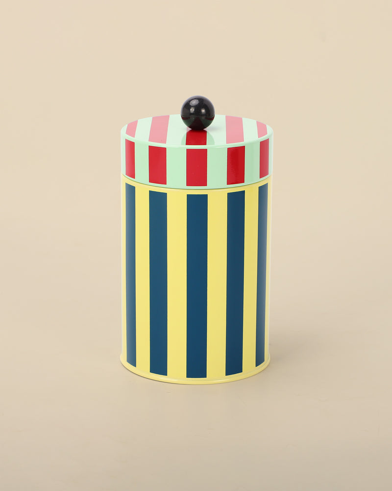 Canister with yellow, blue, red, and green stripes