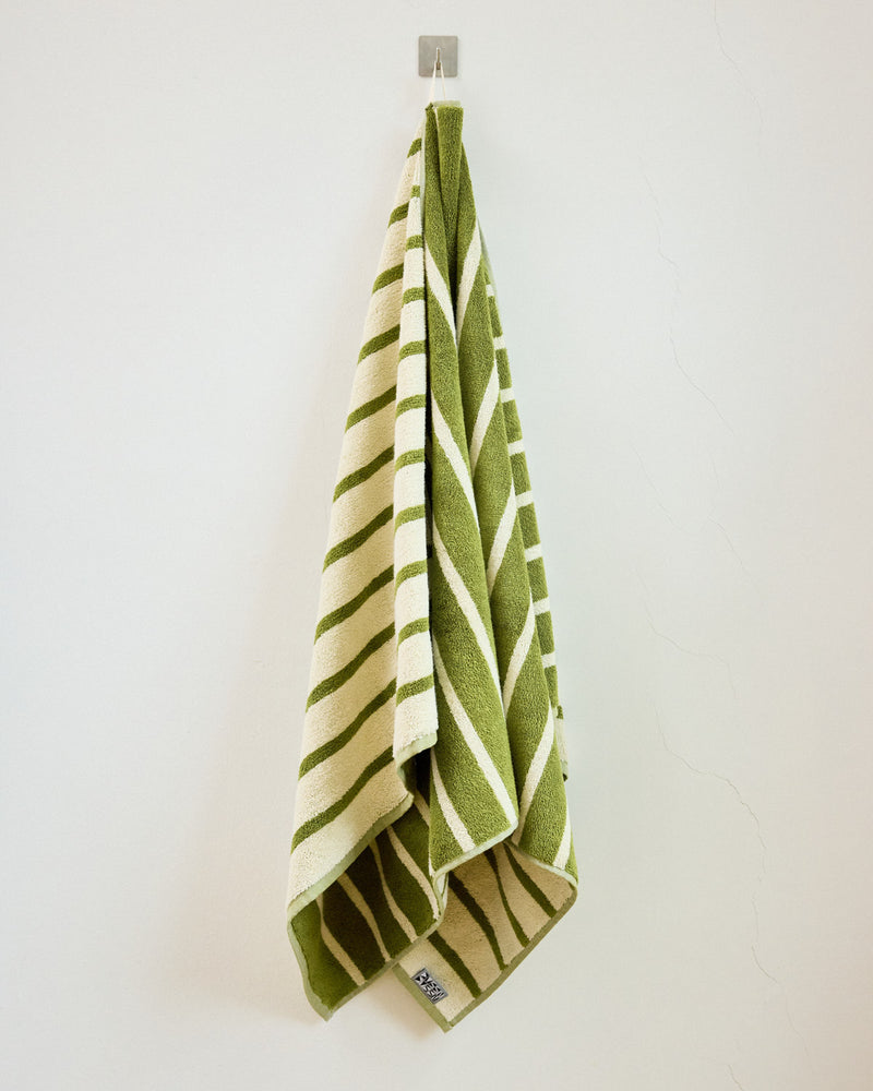 green and white mallard towel on hook