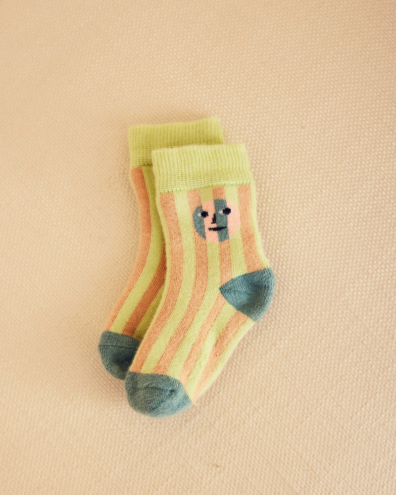 Pair of green and light orange stripe socks with grey heel