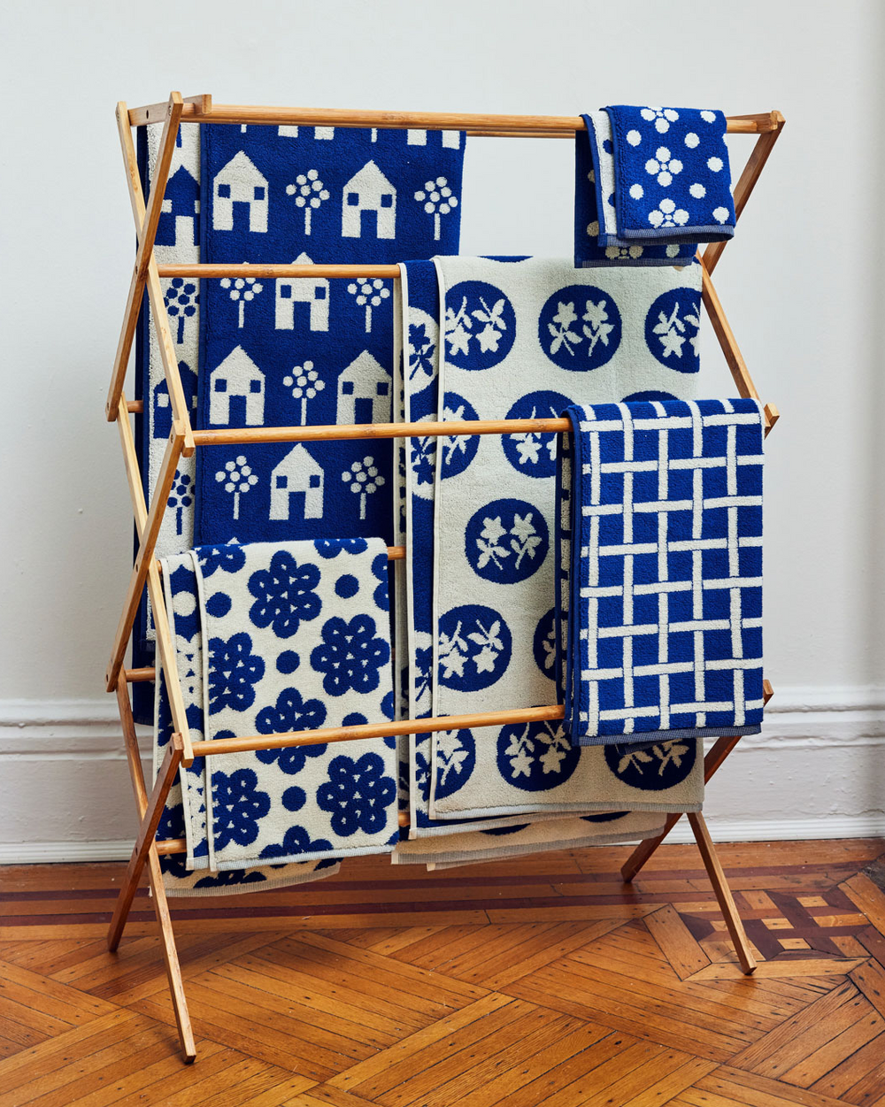 Navy Bath Towels Set of 5 on a rack 