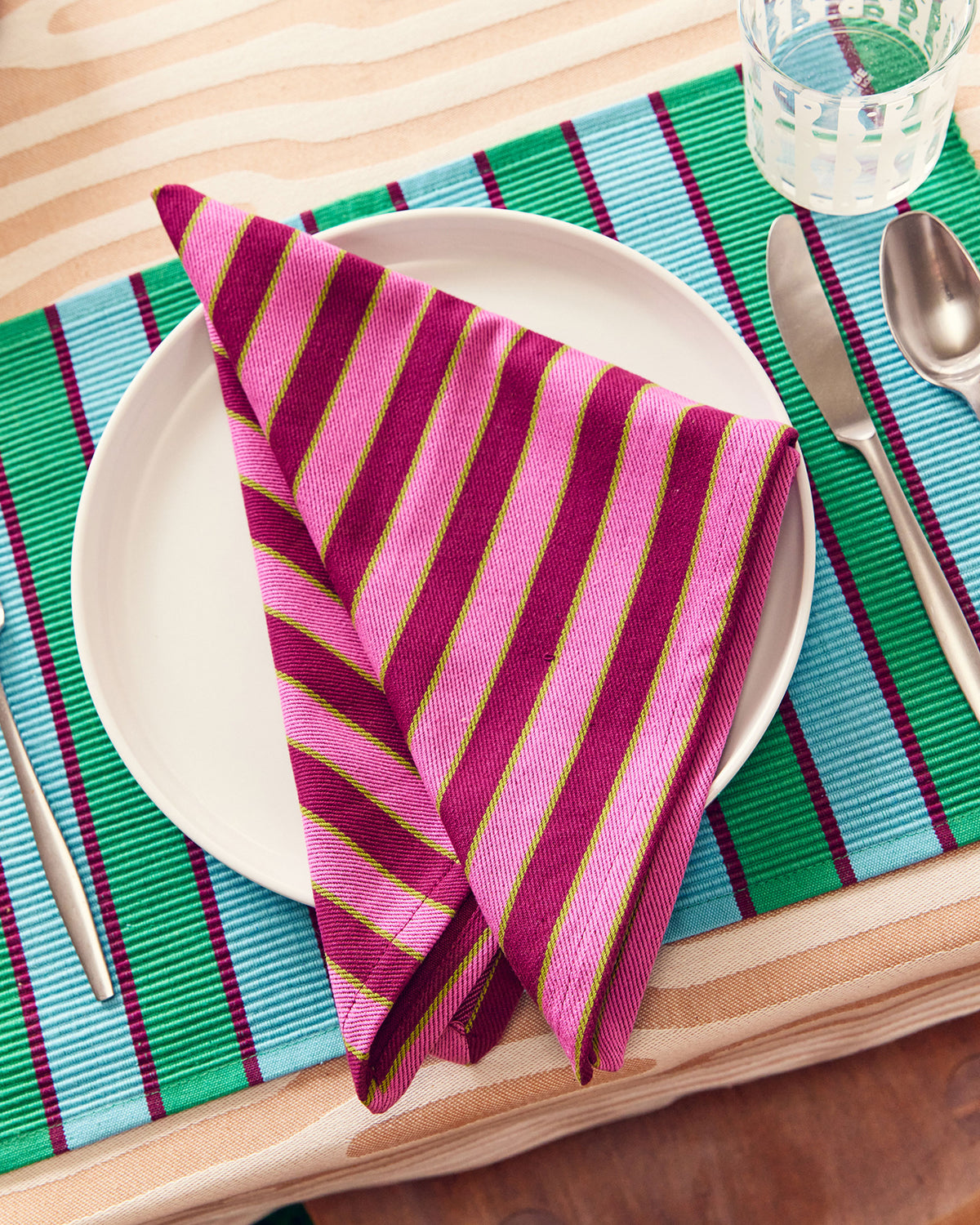 Dusen Dusen Herb Stripe Napkins in Paprika on plate