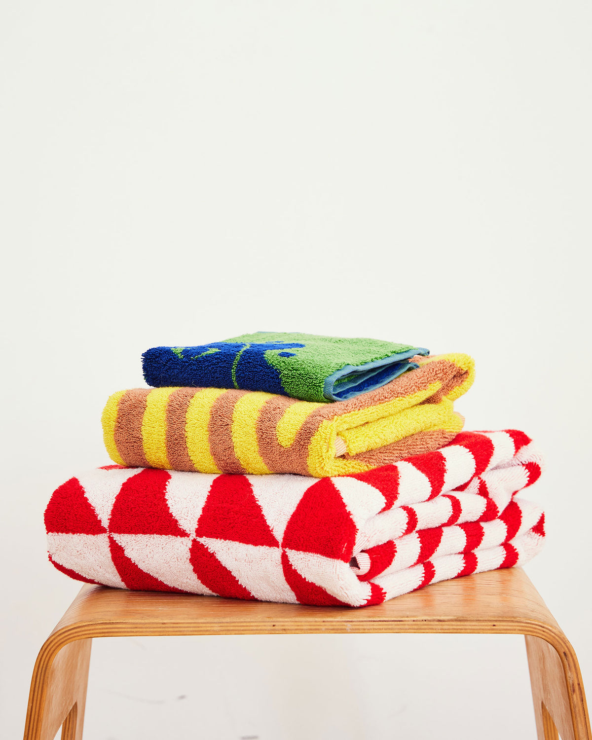 Dusen Dusen Terra Pattern Towels. 100% brushed cotton terry, 700 GSM, in a trio of patterns. Bath towel: 30"x56". Hand towel: 20"x 30". Washcloth: 12"x12". Made in Portugal.