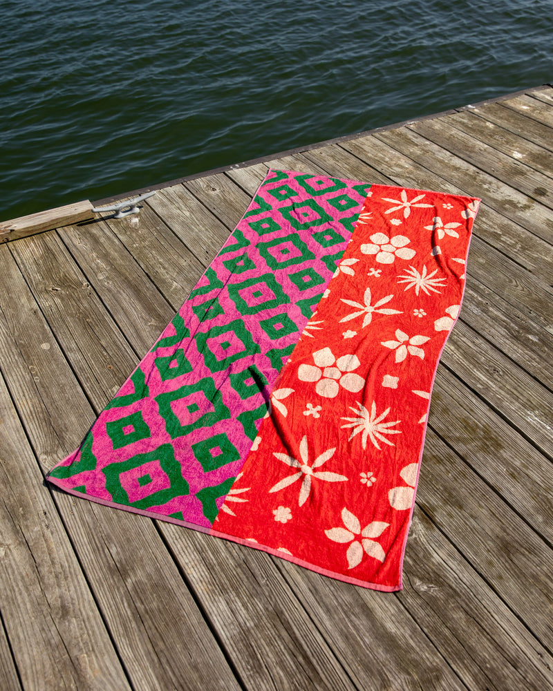 Duo patterned floral towel on wooden dock