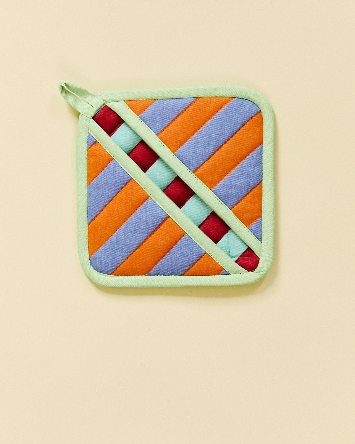 pumpernickel pot holder on beige background 