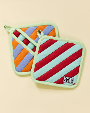 two pumpernickel pot holders on a beige background 