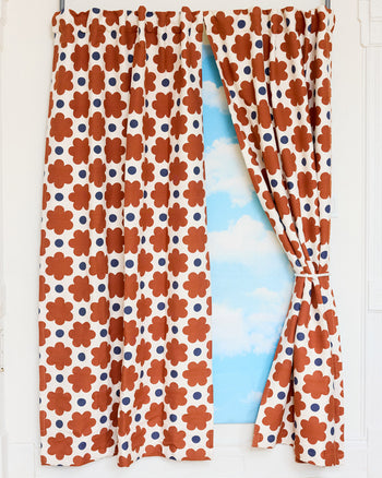 ["Curtains with a floral pattern revealing a blue sky", " If you can't pull yourself together, pull these curtains together and try again tomorrow <br><br> Rod pockets provide a casual, ruffled, and gathered look, while back tabs create a modern, structured, and pleated appearance"]