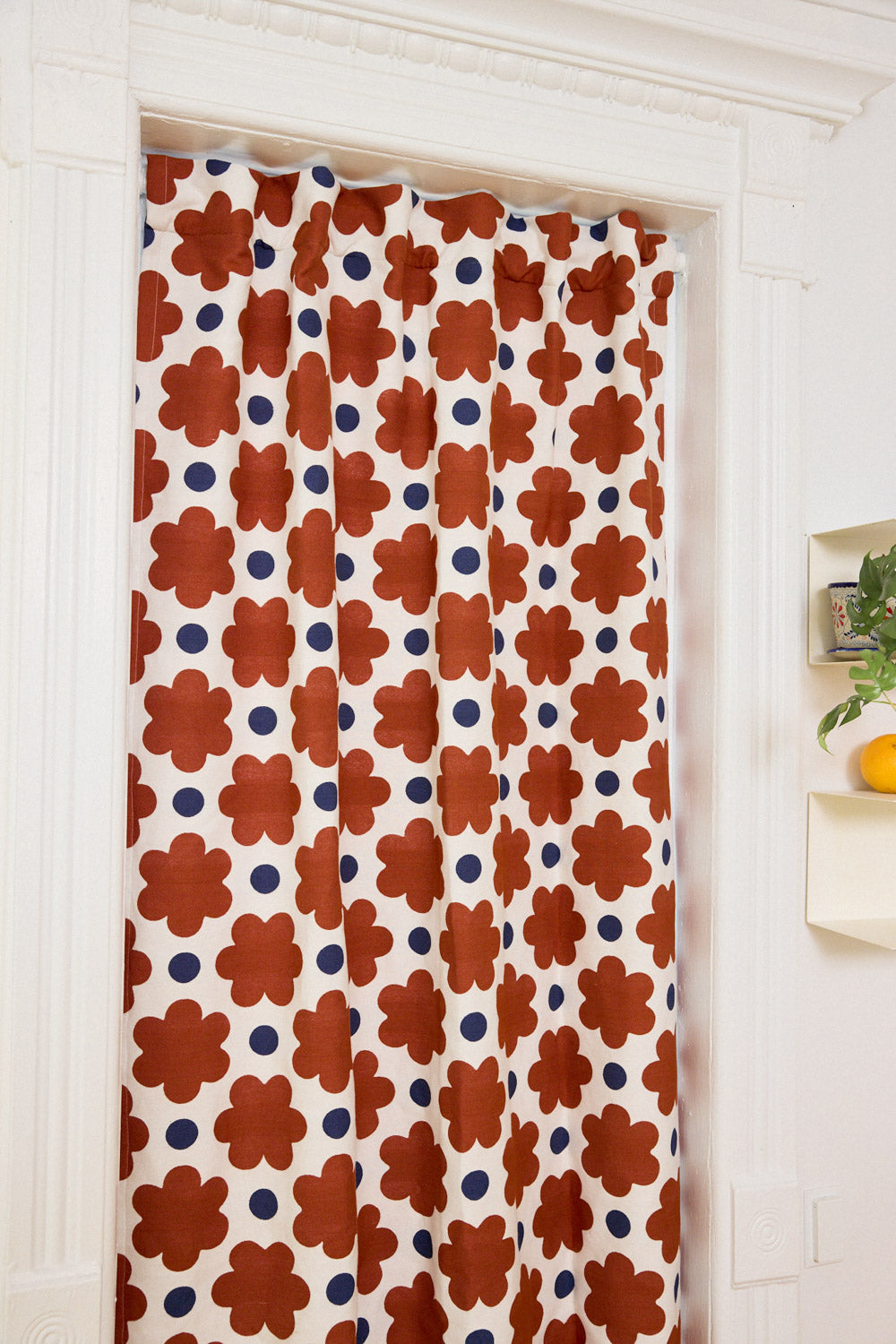 Decorative curtain with floral pattern in a room setting
