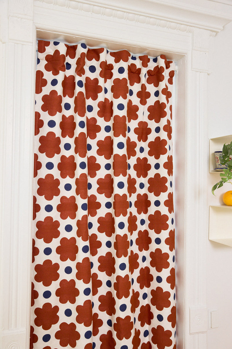 Decorative curtain with floral pattern in a room setting