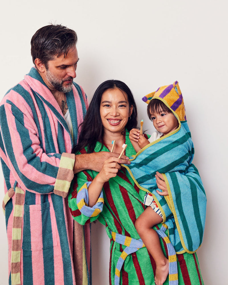 Orange hooded towel with ears with mother and father in robes ;For those beastly moments between bath time and bed time <br> Model wears a size Baby