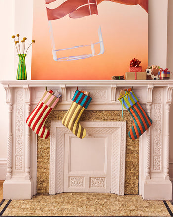 ["Three striped stockings on a mantle ", " A Set of Super Special Striped Stockings for Seasonal Stuffing <br> Includes 1x of each color"]