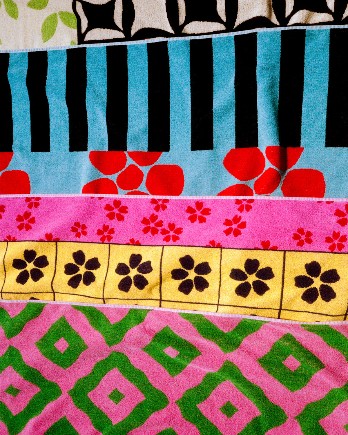 Collection of colorful beach towels for 2026 with various patterns