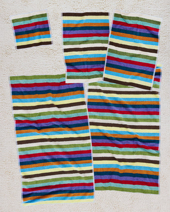 Set of 5 colorful striped towels on a white background