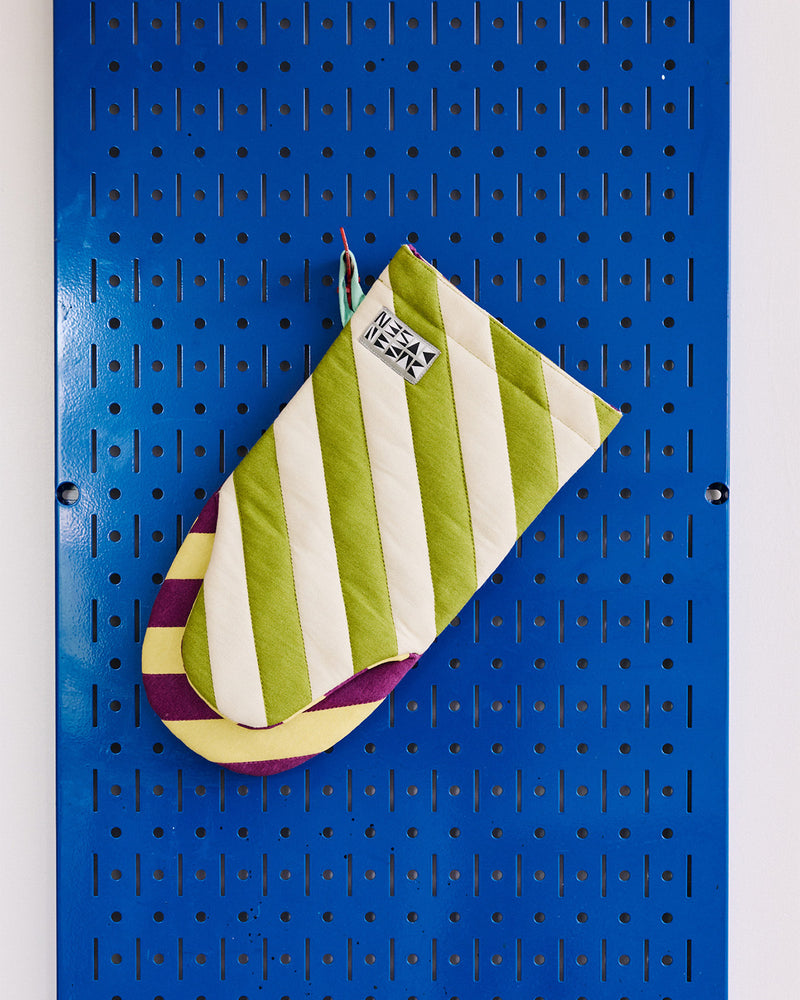 Sourdough oven mitt on blue modular hanging board 