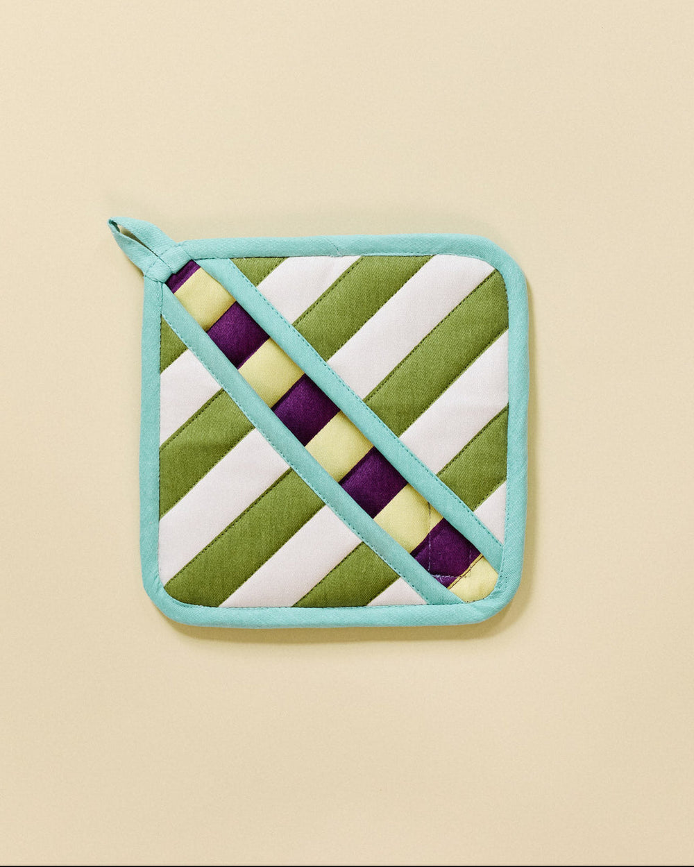 striped pot holder on a beige background 