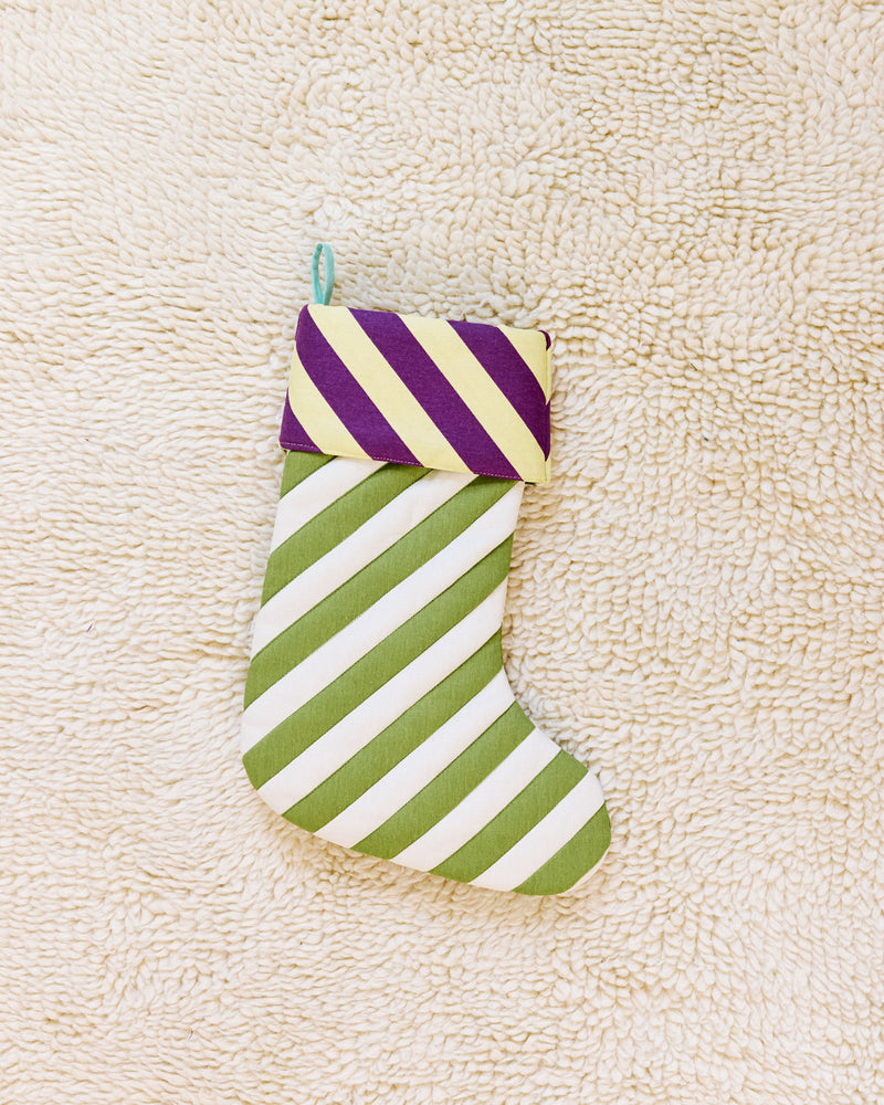 green and whtie stockings in sourdough on beige carpet