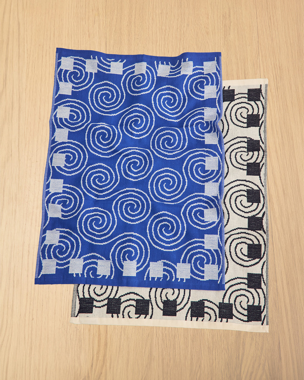 100% Cotton Terrycloth. Waffle weave front and soft loop back. Made in Portugal. In Blue, Butter White, Lavender, and Green.