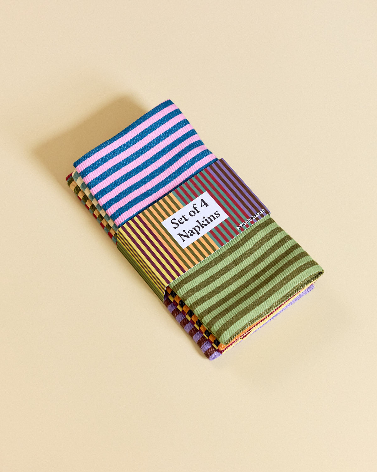 Set of 4 Napkins 2025 Stripe in packaging on beige background