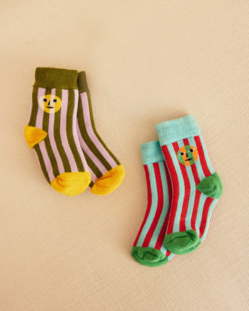 two striped socks with Everybody face on them 