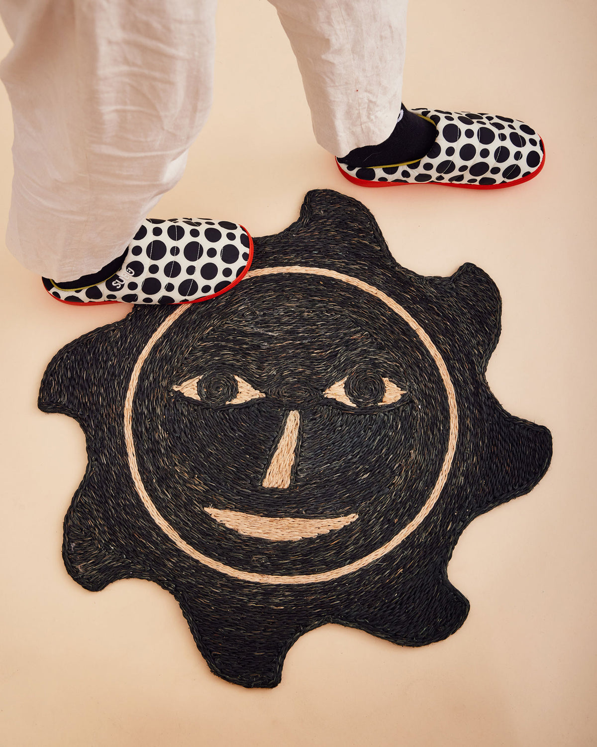 Dusen Dusen Everybody Sun Mat. Doormat made of 100% Handwoven Abaca fiber in the signature Everybody Face design. Made in Philippines. Dry, indoor use is recommended. Vacuum regularly, spot clean as needed.