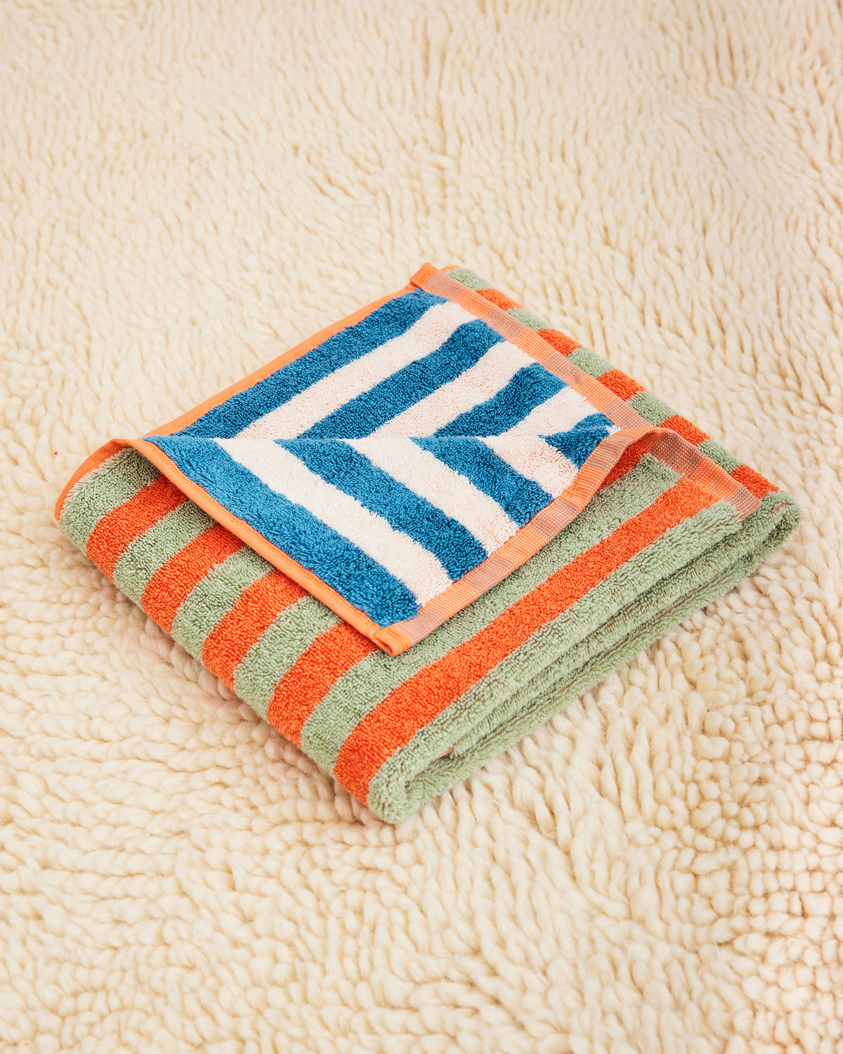 Dusen Dusen Earth Stripe Towels. 100% brushed cotton terry, 700 GSM, reversible striped colorways. Bath towel: 30"x56". Hand towel: 20"x 30". Washcloth: 12"x12". Made in Turkey.