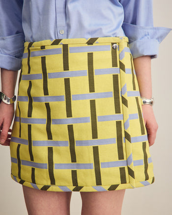 ["Person wearing a yellow skirt with blue and green pattern against a neutral background", " From curtain to skirting<br> <br> Erin is 5'8\" and wears a size M"]