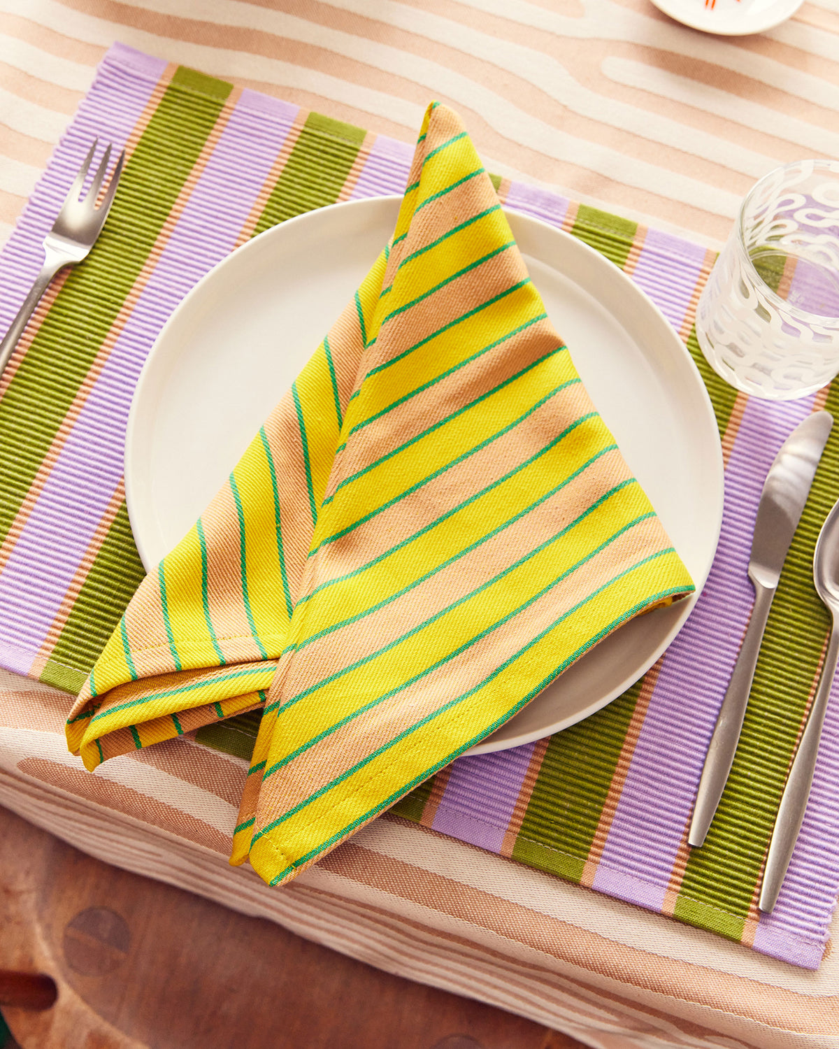 Dusen Dusen Herb Stripe Napkins in Turmeric on Plate