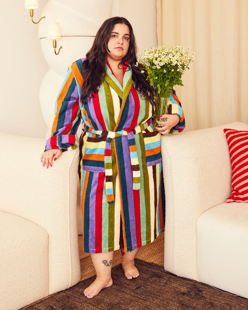 Woman in eucalyptus robe with small daisies 