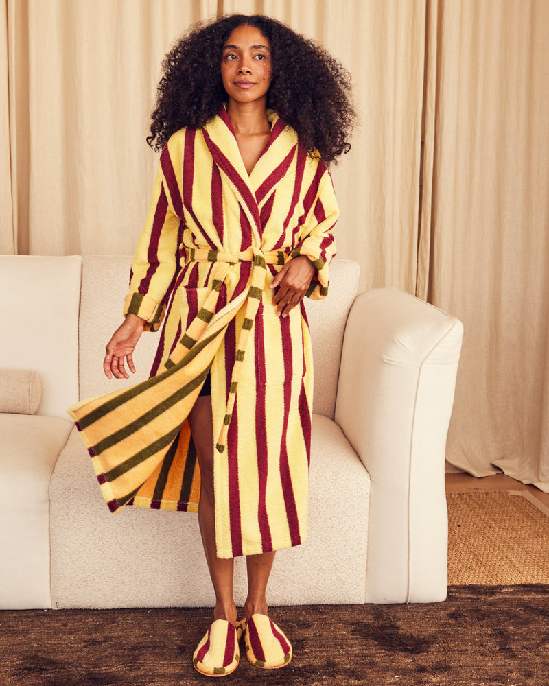 ["Woman wearing a yellow and red striped robe in a living room setting. ", " Ginkready, Ginkset, Ginkgo! <br> Shereen is 5'5\" and wears a S, Jesse is 6'2\" and wears an XL, Erin is 5'8\" and wears a M"]