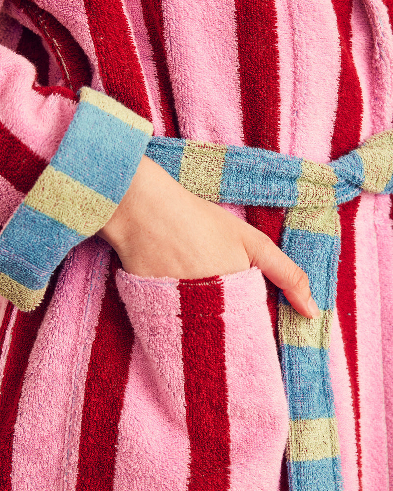 close up of magnolia robe with blue and green stripe tie