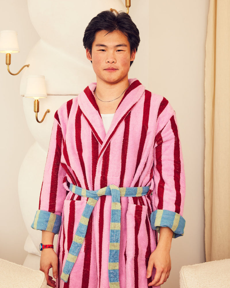 Jesse in magnolia robe in front of lamp