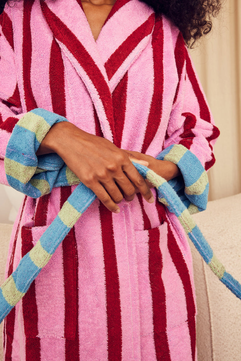 Shereen tying her magnolia robe 