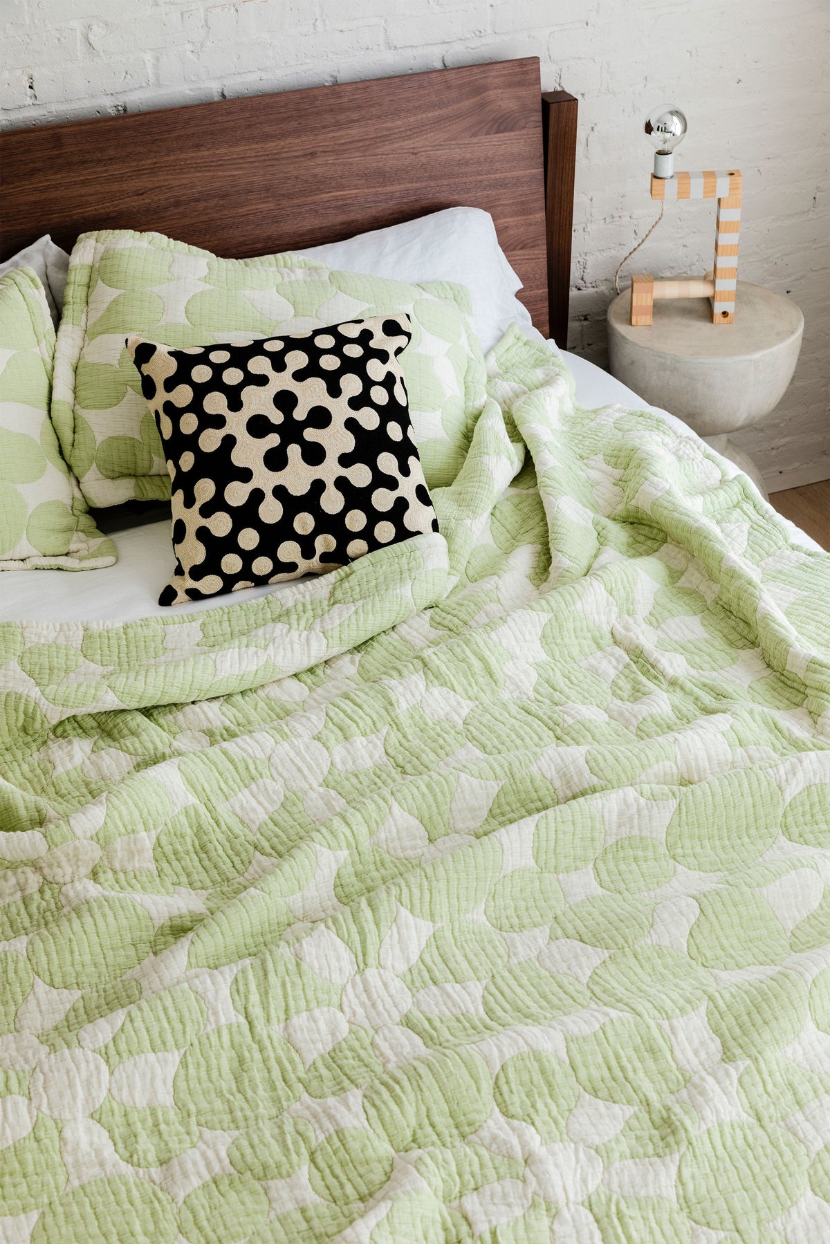 Dusen Dusen Coverlet Set in spring green and white Penrose print. Woven matelassé coverlet with an inner layer of insulation for a quilted effect. Stonewashed, with an extra soft and gauzy hand feel. 100% cotton shell, polyester fill. Machine wash cold and tumble dry low. Made in Portugal;
