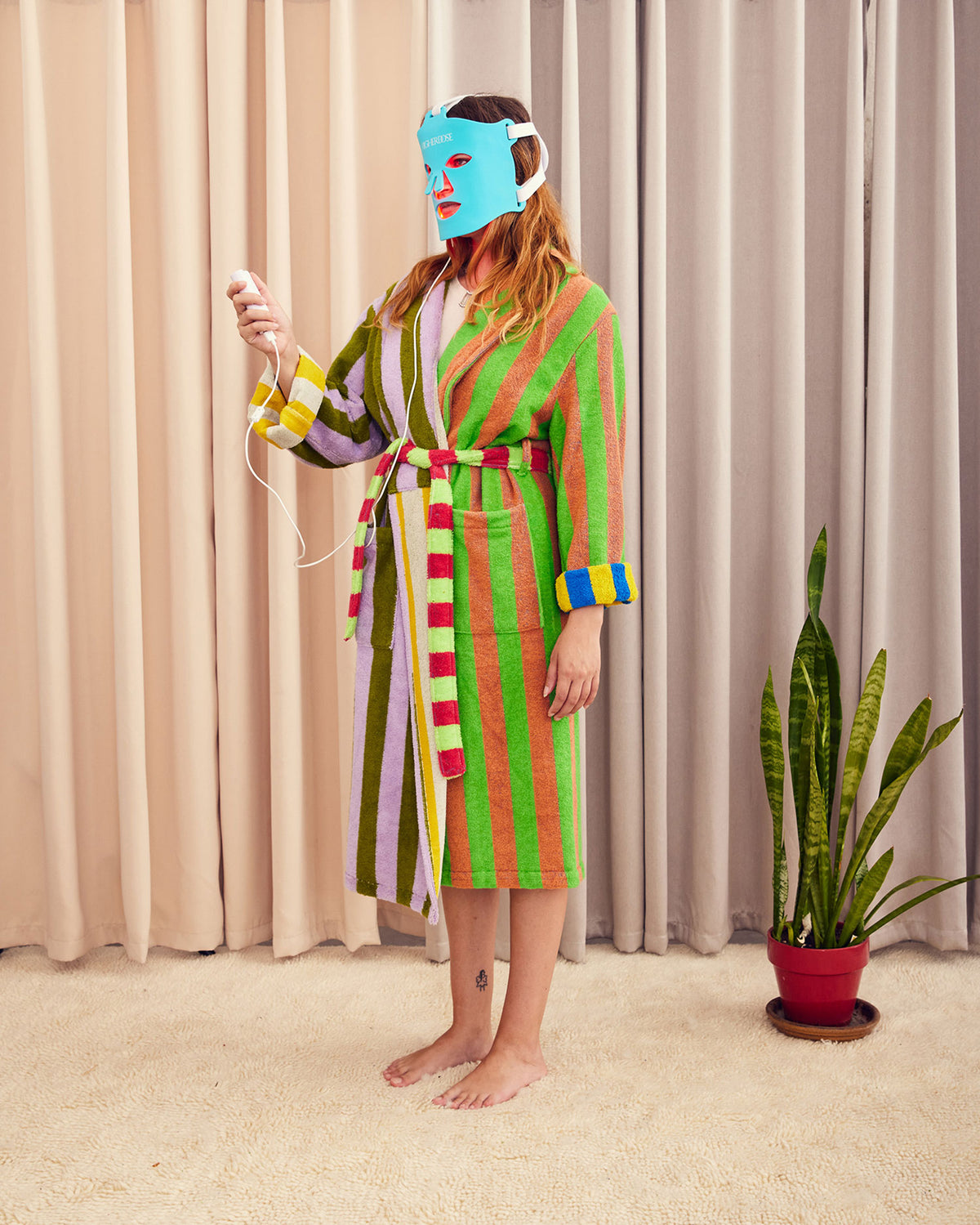 Bathrobe in Surf Stripe. Cotton terry bathrobe with shawl collar, patch pockets, and tie. Double contrasting stripes and colorways on both the outside and inside. 100% cotton terry, 450 gsm. This item is Oeko-Tex Standard 100 certified (no harmful chemicals were used during production). Made in Turkey.