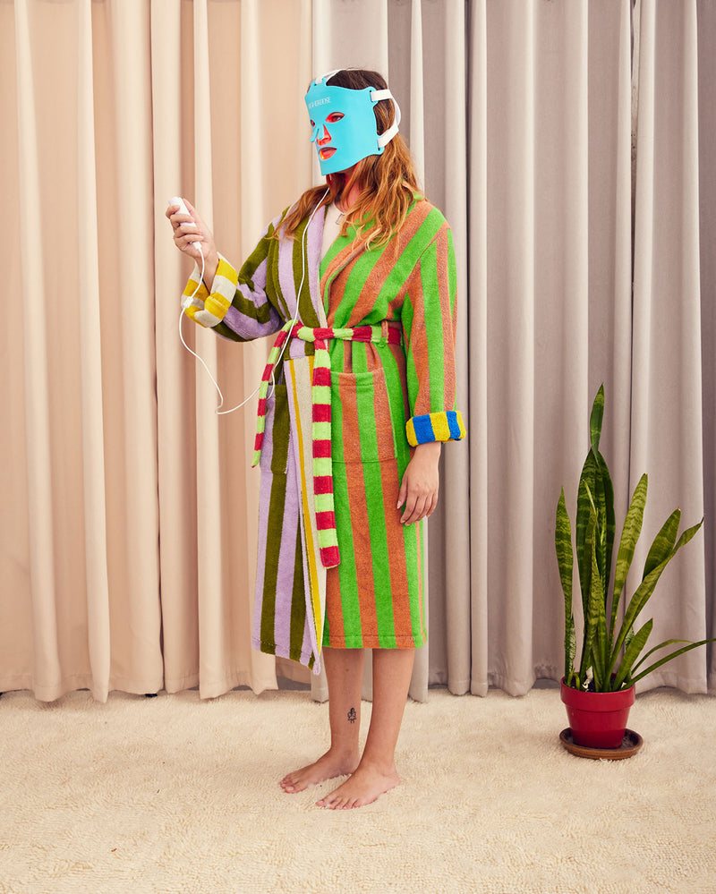 Bathrobe in Surf Stripe. Cotton terry bathrobe with shawl collar, patch pockets, and tie. Double contrasting stripes and colorways on both the outside and inside. 100% cotton terry, 450 gsm. This item is Oeko-Tex Standard 100 certified (no harmful chemicals were used during production). Made in Turkey.