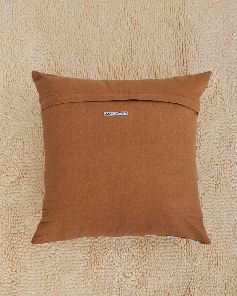 Dusen Dusen Basket Pillow. Basket pillow in multi-color check print. 100% cotton tufted pillow. Natural canvas back with zip closure. Available as 24" x 24". Spot clean only. Made in India.