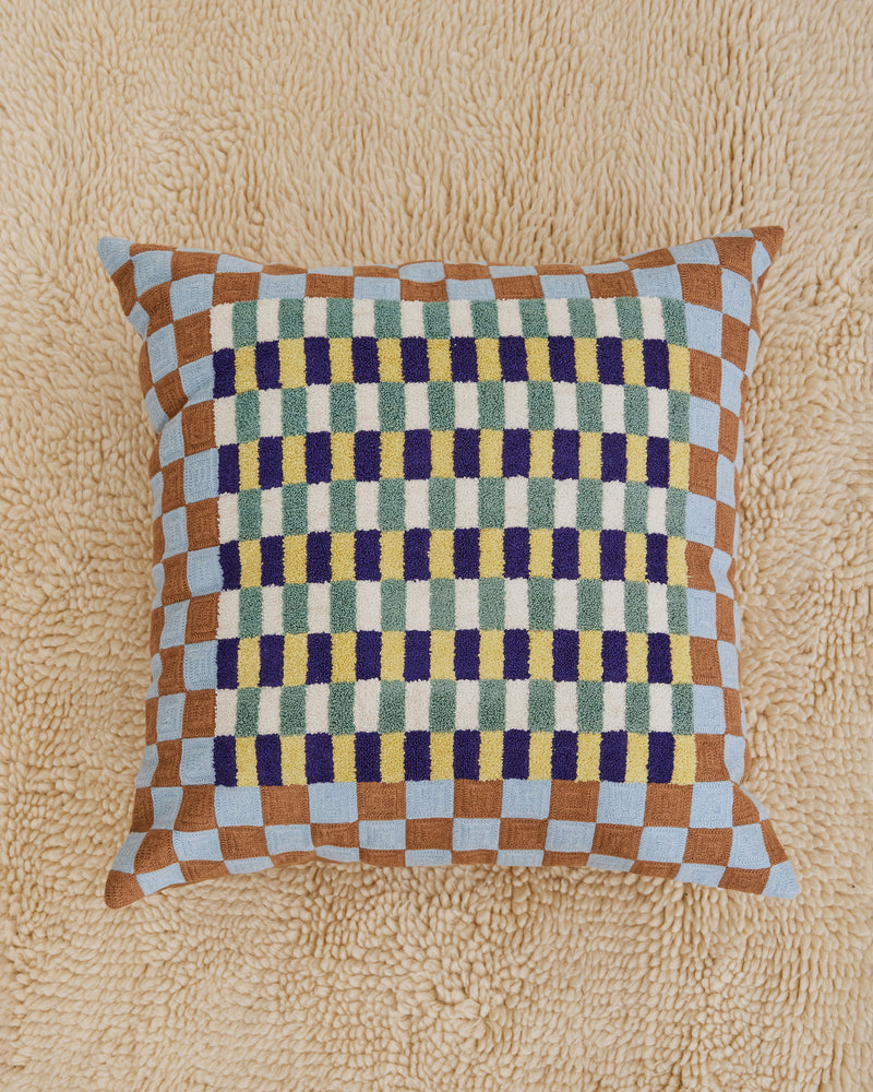 Dusen Dusen Basket Pillow. Basket pillow in multi-color check print. 100% cotton tufted pillow. Natural canvas back with zip closure. Available as 24" x 24". Spot clean only. Made in India.