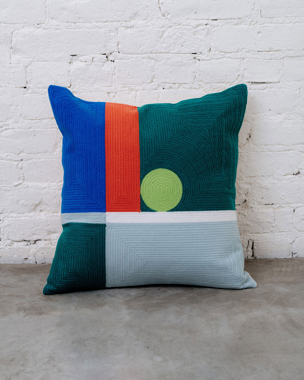 Dusen Dusen Dot Pillow. Embroidered pillow in multi-colored Dot print. 100% cotton, back zip, non-embroidered natural canvas back. Available as 18" x 18". Spot clean only. Made in India.Pillow insert is a polyfill down alternative and mimics the fluffiness of natural down. Insert made in the USA.