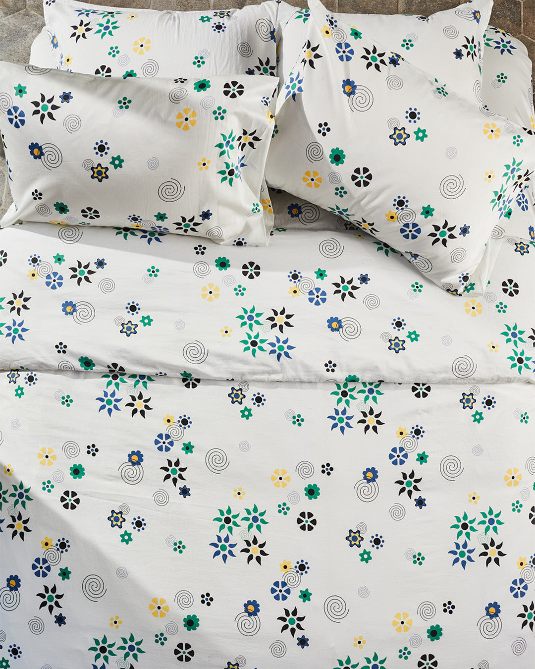 Dusen Dusen Duvet and Sheet Sets in multi-colored Flower print. Include an individual Flat Sheet to round out a Sheet Set. 100% cotton sateen, 300 thread count. Machine wash cold and tumble dry. Made in Portugal.   Our cotton sateen is smooth and cool to the touch, and features a slight lustrous finish. The sateen softens further with every wash;