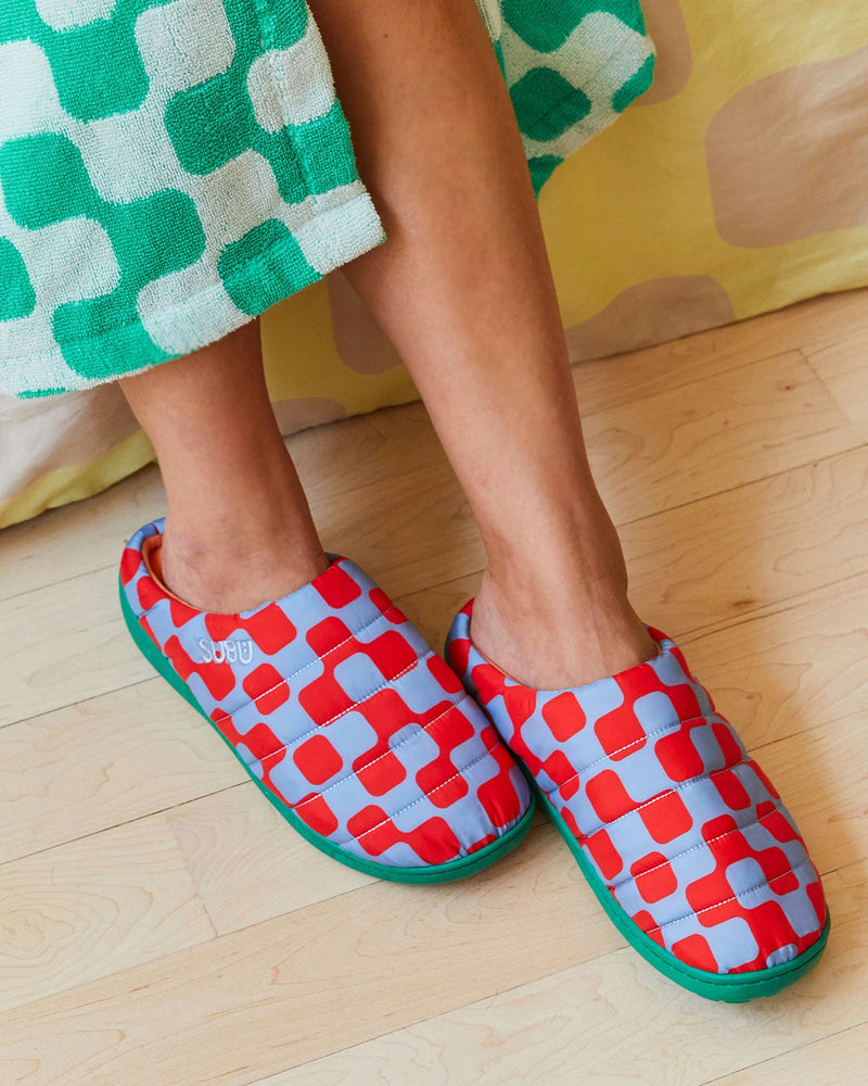 Dusen Dusen for MoMA Subu Slippers in Net The slipper's nylon shell is adorned with our red and blue Net pattern and filled with polyester down for warmth. Plushy orange insole for peak chromatic and physical comfort