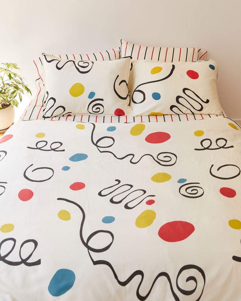 Dusen Dusen Palma Duvet Set. Duvet cover in cream with multicolor Palma print. 100% cotton sateen, 300 thread count. Machine wash cold and tumble dry. Made in Portugal. Our cotton sateen is smooth and cool to the touch and features a slightly lustrous finish.