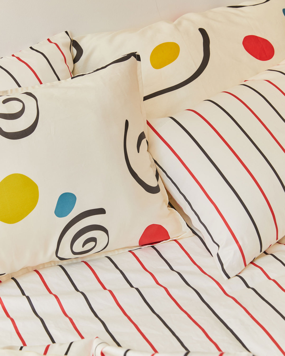 Dusen Dusen Palma Duvet Set. Duvet cover in cream with multicolor Palma print. 100% cotton sateen, 300 thread count. Machine wash cold and tumble dry. Made in Portugal. Our cotton sateen is smooth and cool to the touch and features a slightly lustrous finish.