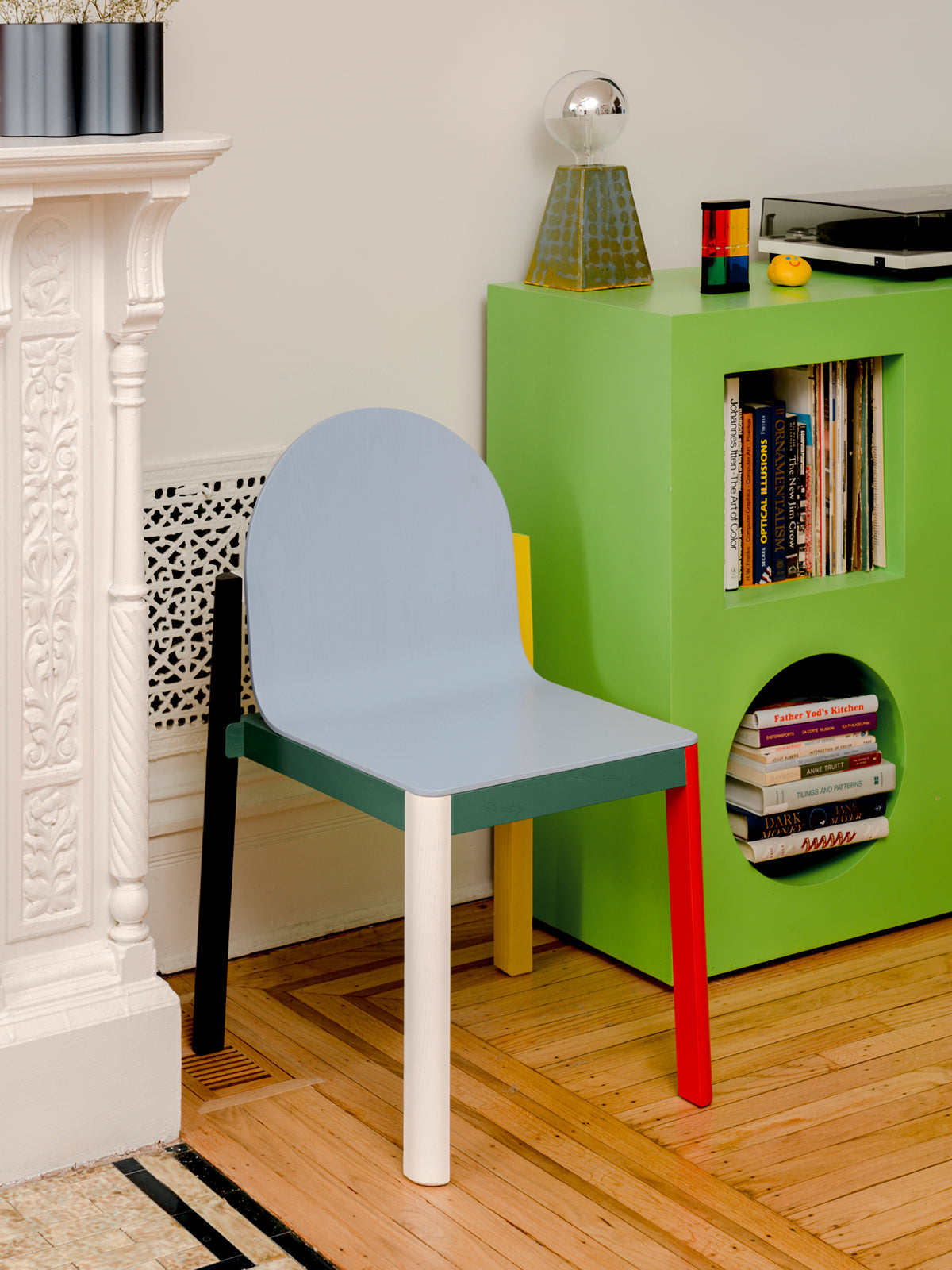 cleo chair v1 next to green console